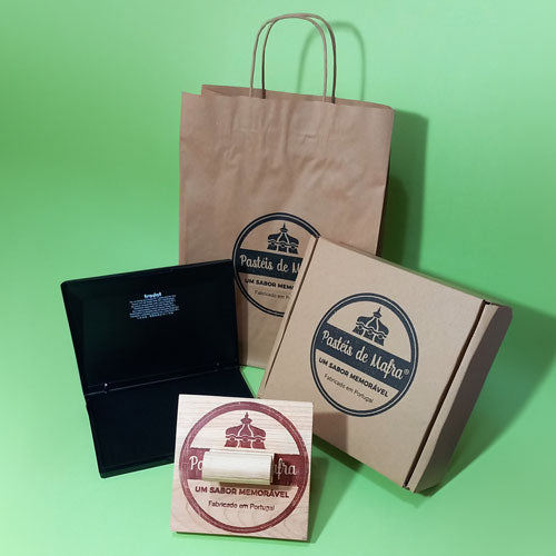Large custom stamp on boxes and paper bags, ideal for low-cost packaging branding