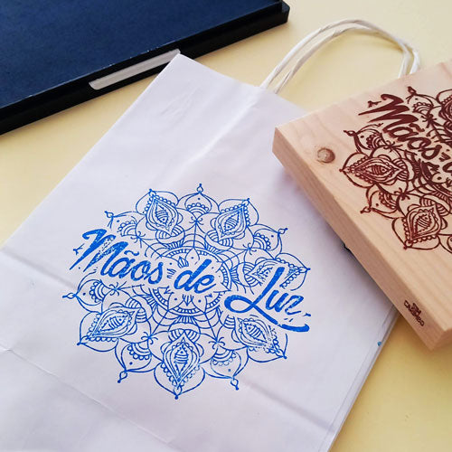 Large custom stamp applied to boxes and paper bags for cost-effective branding